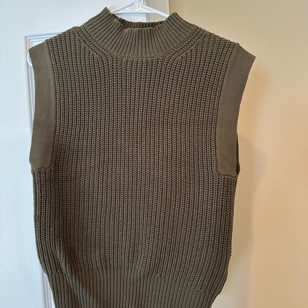 Sleeveless knit sweater top. Only worn once. Like new.